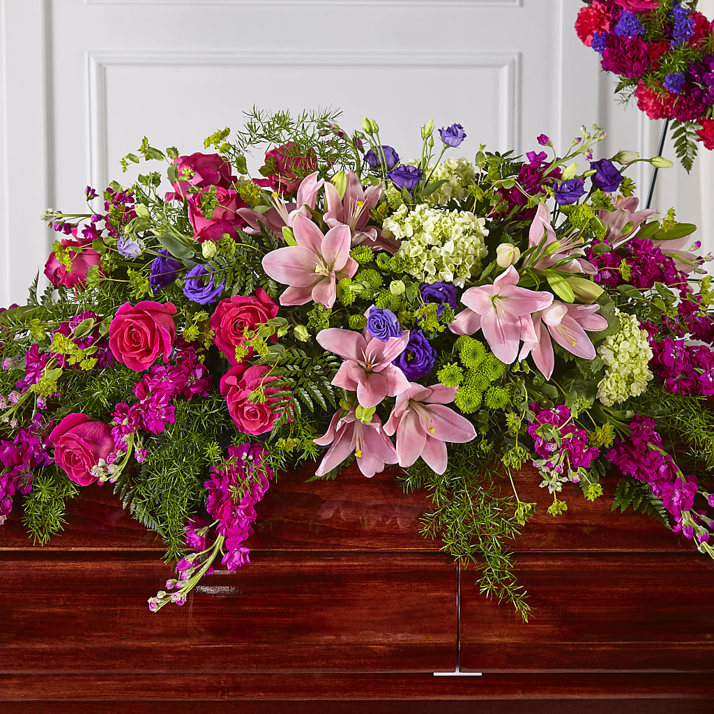 Radiant Tribute Casket Spray flower arrangement by Honeybee Floral