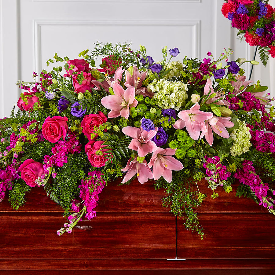 Radiant Tribute Casket Spray flower arrangement by Honeybee Floral