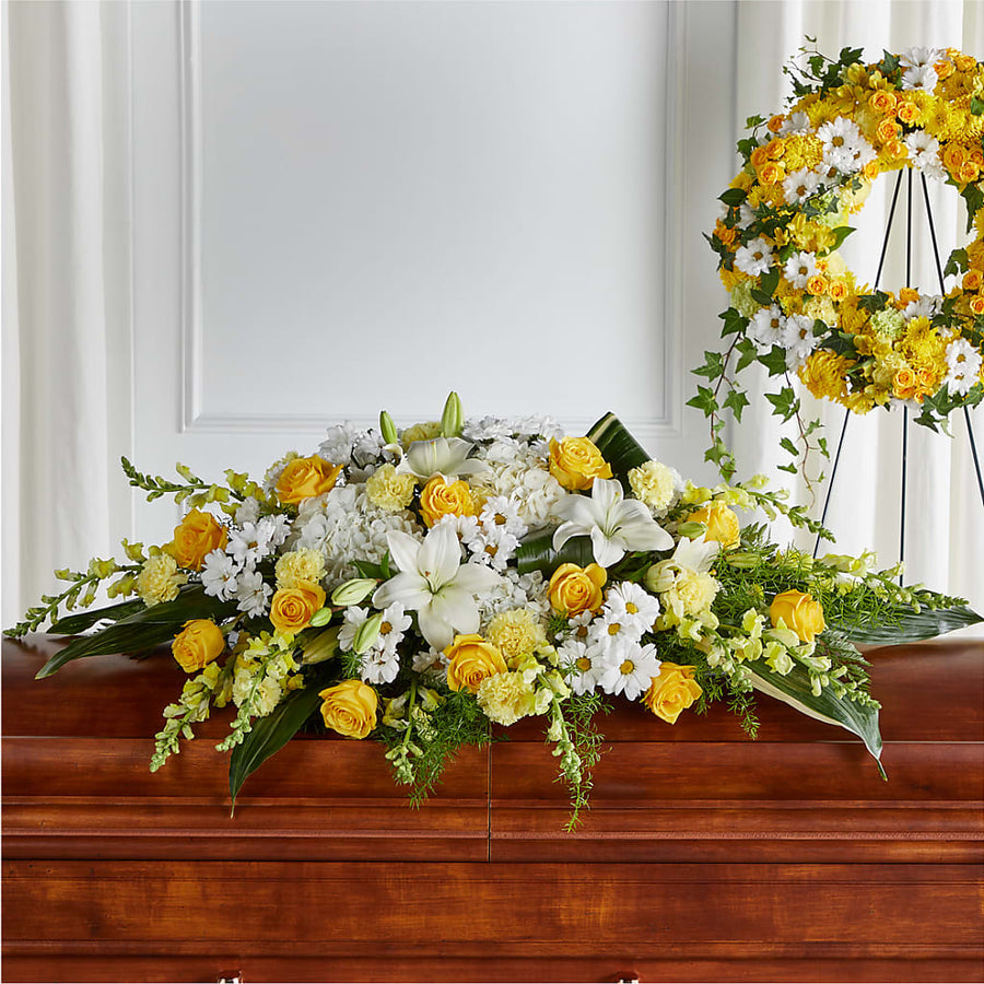 Golden Harmony Casket Spray flower arrangement by Honeybee Floral